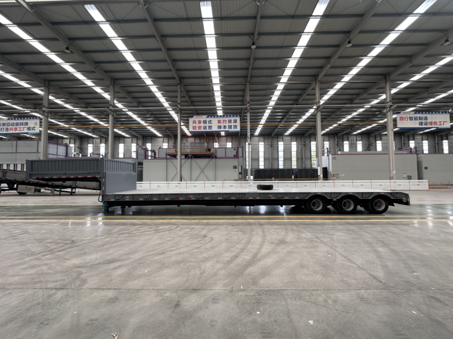 The customer from Kazakhstan ordered a low-bed semi-trailer for mechanical transportation